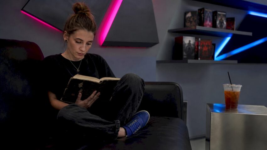 Person reading ergodic literature at vintage desk