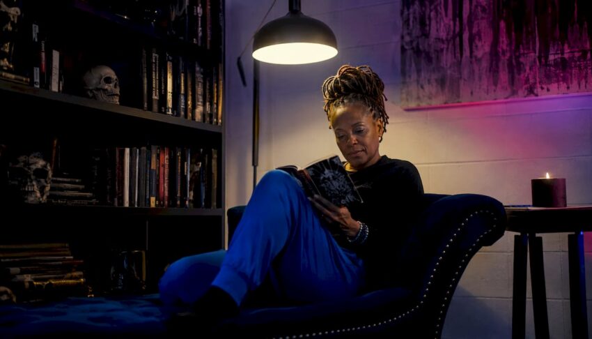 Woman reading dark psychological thriller book
