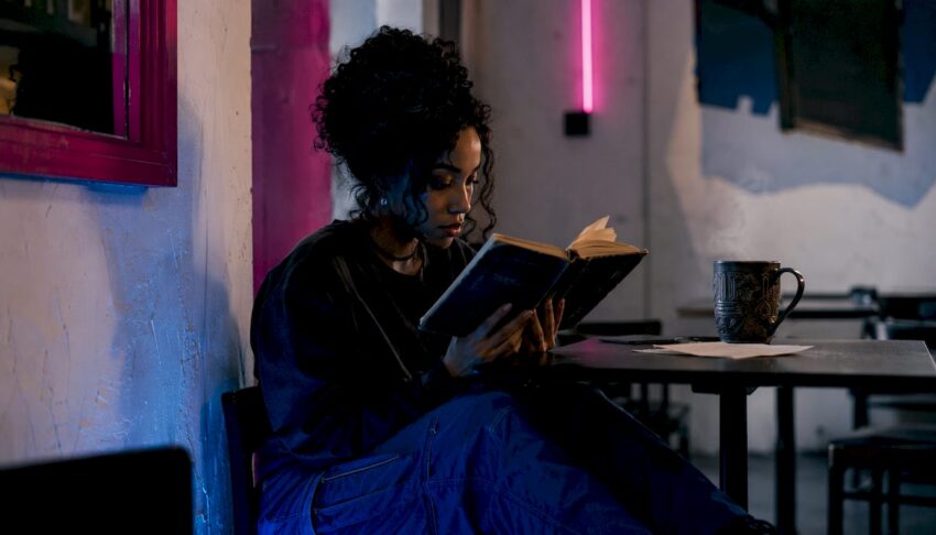 Person reading dystopian horror novel