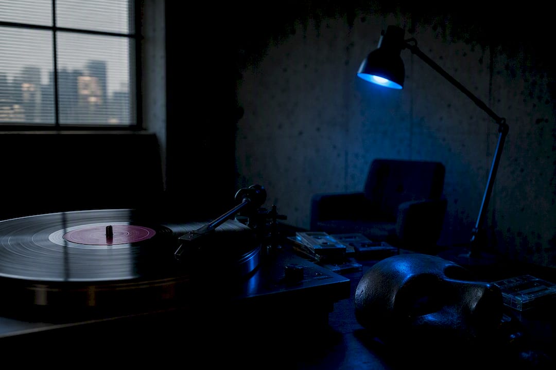 Vinyl record and dark office objects with colored lighting