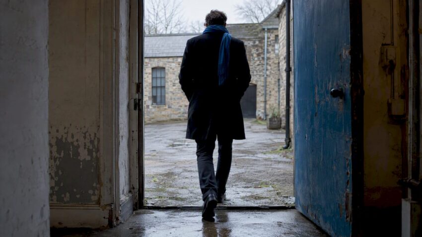 Figure crossing a dark psychological threshold
