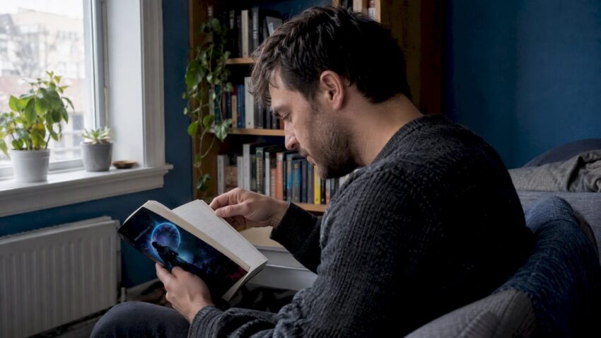 Reader checking a passage in Evolution A200