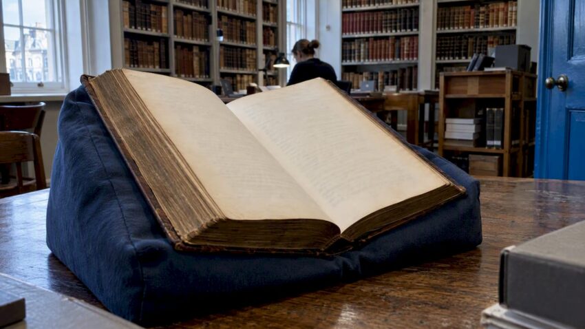 Open Paradise Lost volume in an archive